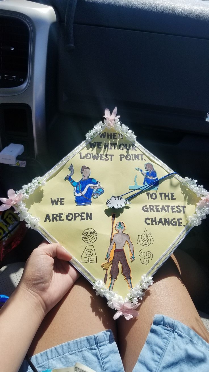 someone is holding up a graduation cap with pictures on it that says, the lowest point we are open to the greatest change