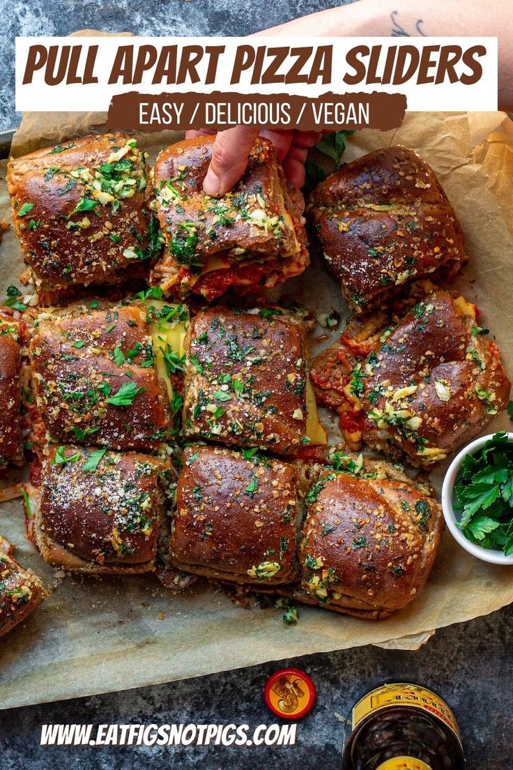 the pizza sliders have been cut into squares and are ready to be eaten with dipping sauce