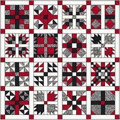 a red and white quilt with black squares on the front, one block in the middle