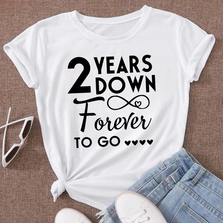 2 Years Down Forever To Go - 2nd Wedding Anniversary Couple T-Shirt * Solid Color, Available In White * 100% Cotton * Imported * Handmade Designed With Black Text Htv * Lightweight, Soft, Classic Fit, Double Needle Sleeve And Bottom Hem Summer Anniversary Graphic Print Tops, Graphic Tee With Short Sleeves For Anniversary, Summer Cotton Tops For Anniversary, Cotton Tops For Anniversary In Summer, Cotton Tops For Summer Anniversary, White Text Print Top For Anniversary, Anniversary Crew Neck Top With Graphic Print, White Graphic Print Top For Anniversary, Anniversary Letter Print T-shirt For Summer