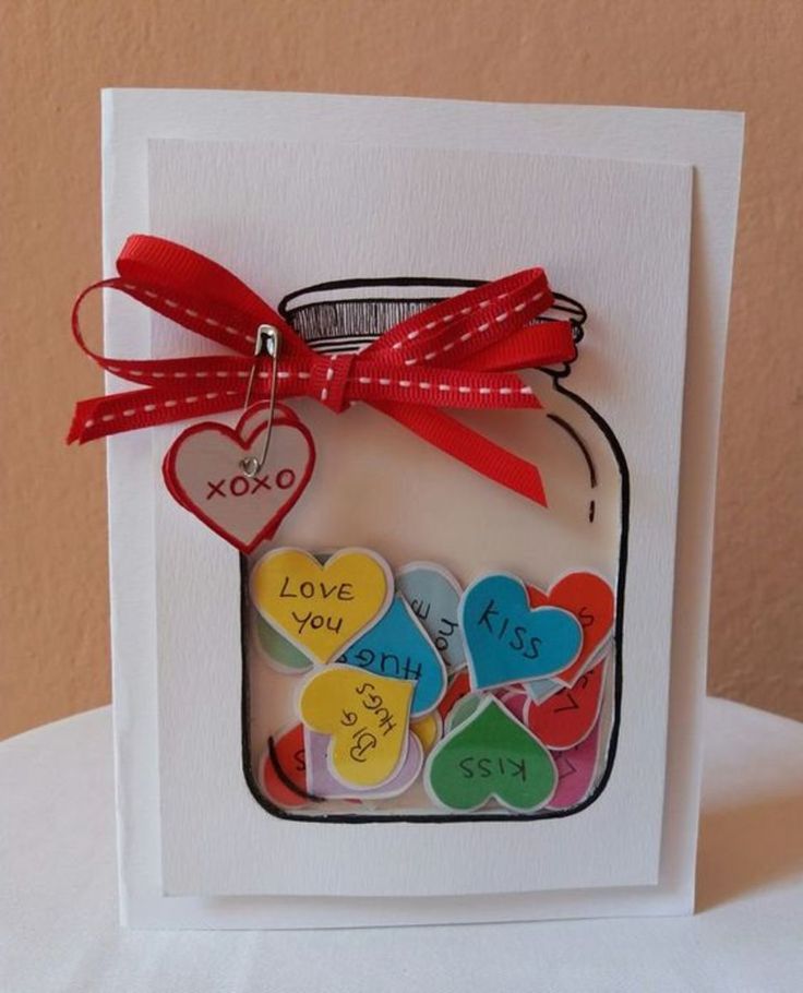 a card with hearts in a mason jar