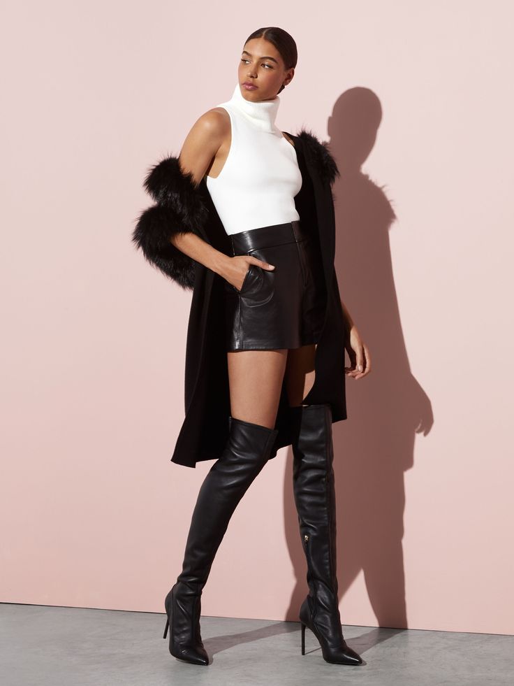 Who says shorts are just for the summer? The Cady leather short is the perfect short for fall. Made with 100% leather, it'll keep you warm on those chillier days and nights, just add tights and your favorite boots. In classic black, it's versatile, pairing perfectly with every top, blouse, and sweater you wear it with. alice + olivia Cady High Waisted Leather Short Olive Green Shorts, Satin Trousers, Olivia Black, Velvet Shorts, Leather Short, Destroyed Denim, Flowy Shorts, Favorite Boots, Alice And Olivia