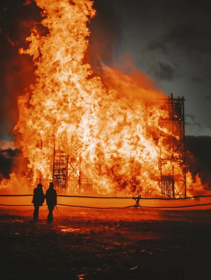 two people standing in front of a large fire with the words help, god thing i have an emergency fund