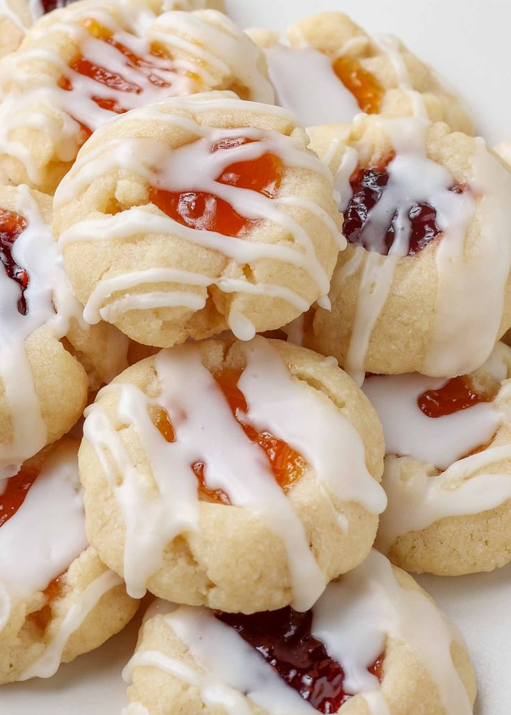 a white plate topped with cookies covered in icing