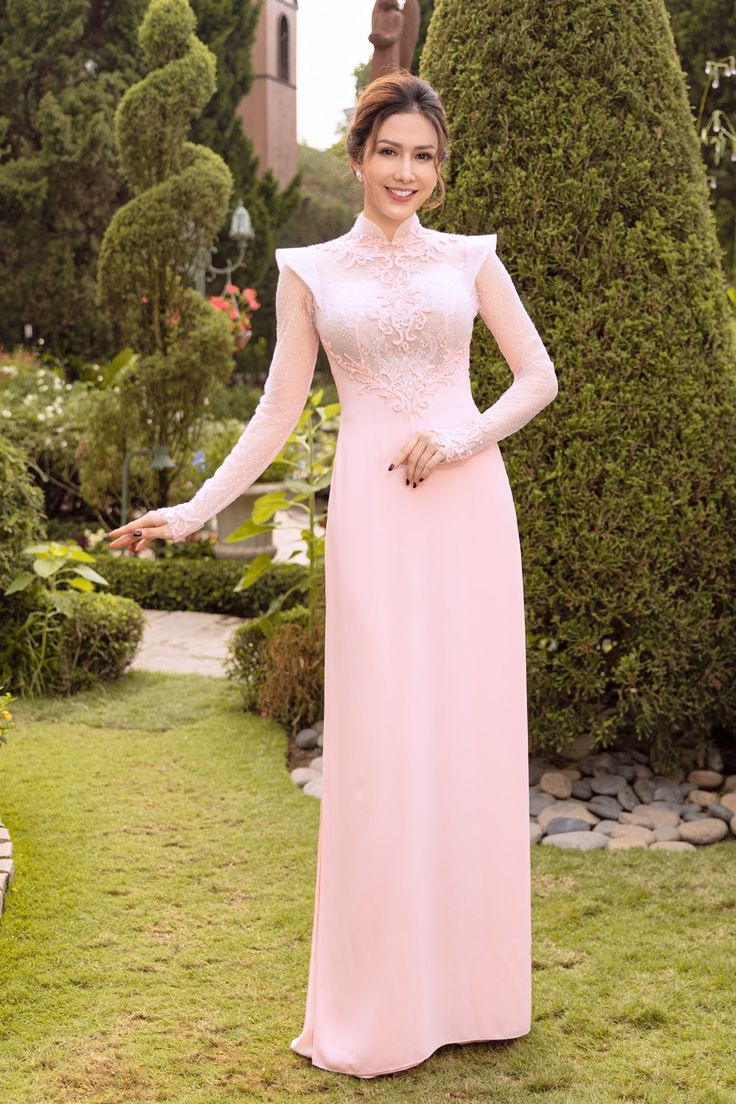 Traditional collar Fabric: Crepe, lace, beading Long sleeves Type: Modern ao dai Elegant Wedding Gown With Embroidered Sleeves, Fitted Ao Dai With Lace Sleeves For Wedding, Fitted Wedding Gown With Embroidered Sleeves, Elegant Ao Dai With Lace Sleeves For Ceremony, Pink Fitted Ao Dai For Ceremony, Fitted Pink Ao Dai For Ceremony, Elegant Ao Dai With Lace Sleeves For Wedding, Fitted Dress With Embroidered Sleeves For Wedding, Elegant Wedding Ao Dai With Lace Sleeves