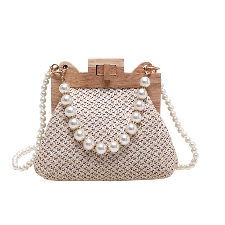 Introducing our Island Boho Mini Pearl Handbag – a petite marvel that encapsulates the essence of carefree coastal style. Crafted from natural straw, adorned with a wooden handle, and embellished with lustrous pearl beads, this mini pearl handbag is a charming blend of earthy textures and seaside elegance. Imagine the gentle rustle of straw under the summer breeze, complemented by the smooth wooden handle that adds a touch of exotic charm ~ We love how the pearl beads delicately glisten, evoking Pearl Beach, Document Bag, Straw Beach Bag, Large Clutch, Luxury Designer Handbags, Changing Bag, Trending Handbag, Purse Styles, Designer Shoulder Bags