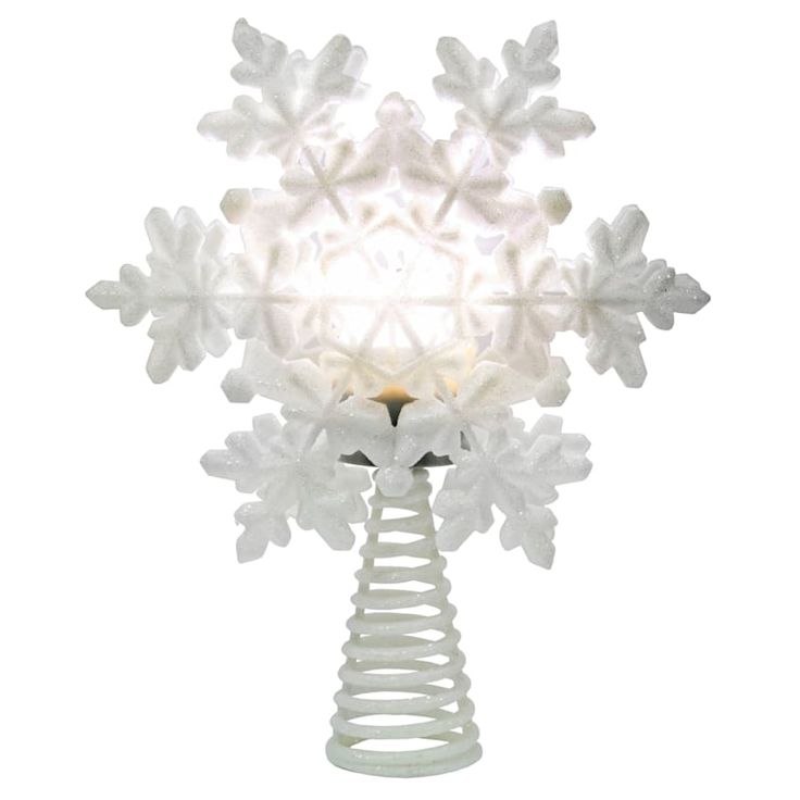 a snowflake shaped light sitting on top of a white table