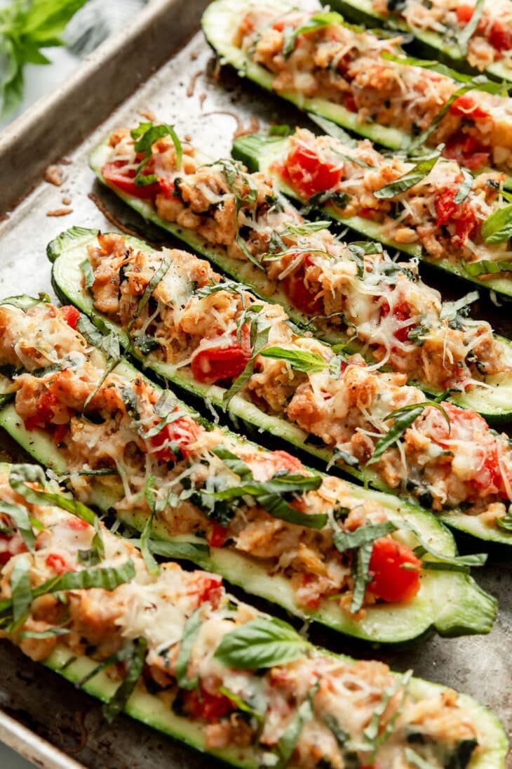 the zucchini boats are stuffed with meat and vegetables