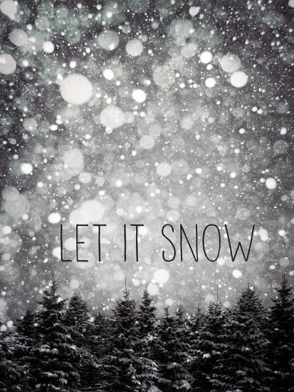 the words let it snow written in black and white on a snowy background with trees