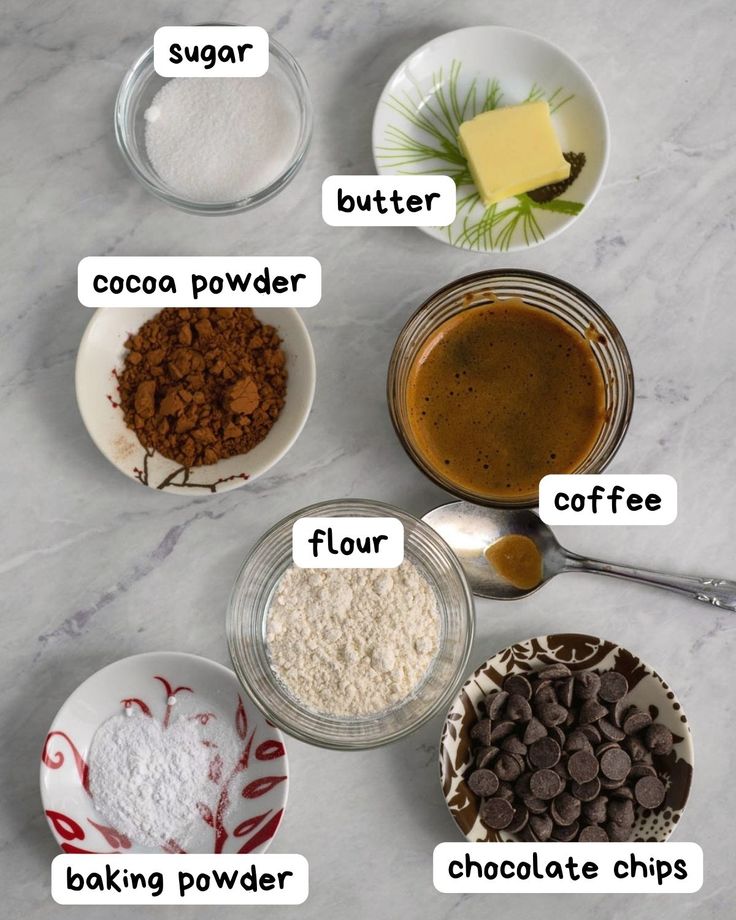 the ingredients for chocolate cake are shown in bowls