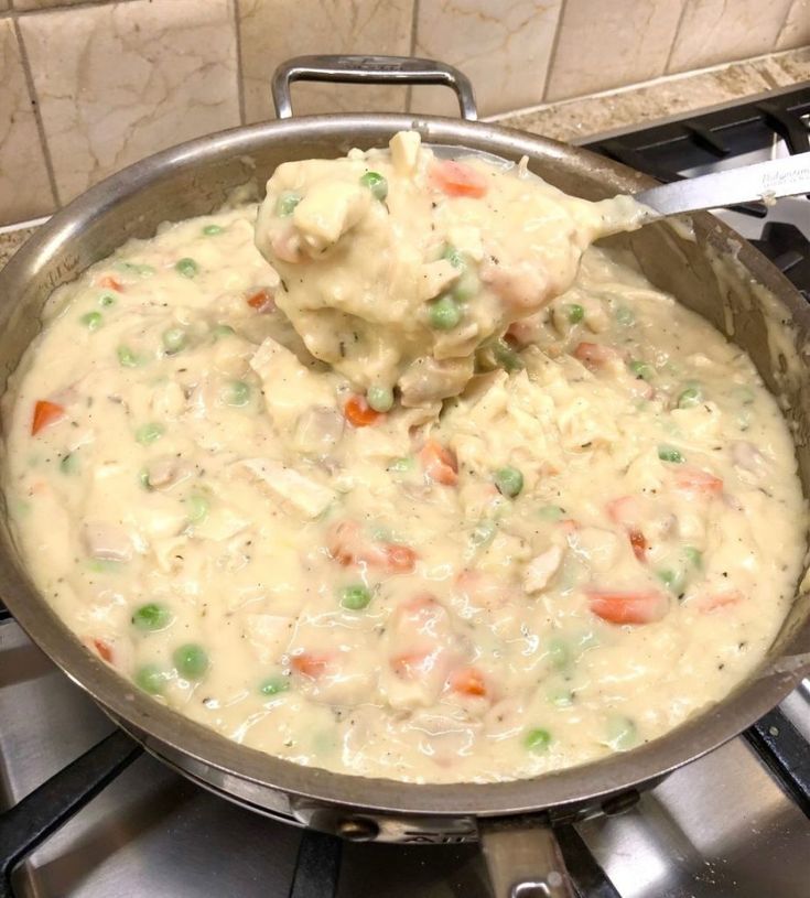 a pan filled with food sitting on top of a stove