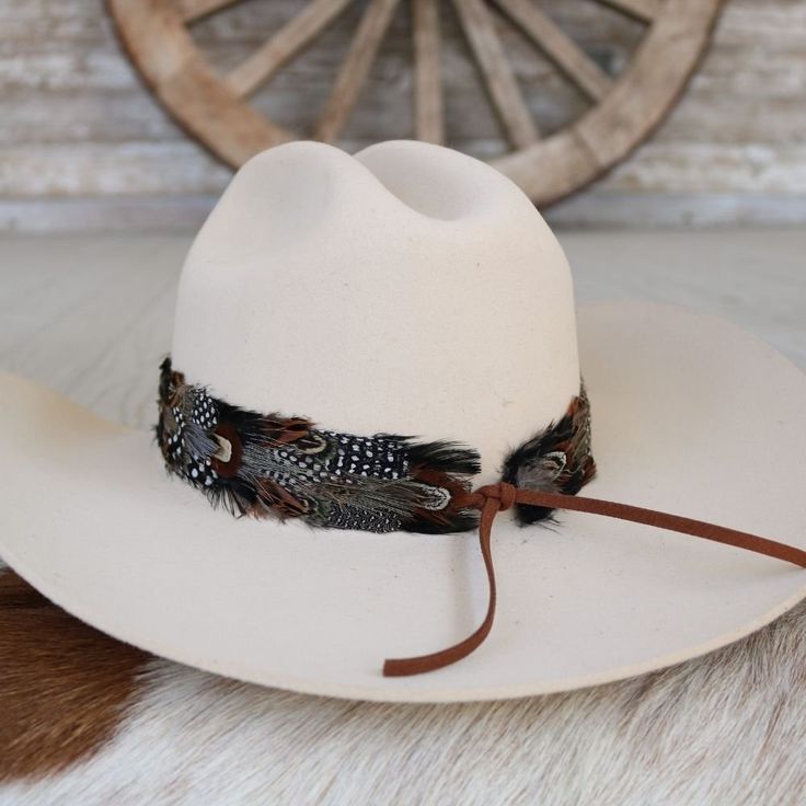 1 Unit Width: 4 cm Length: approx. 58cm (not including leather ties) One size fits most. Adjustable with leather ties. Hat not included. CA Residents: Prop 65 Warning ↗️ Feather Hat Band, Colored Feathers, Coloured Feathers, The Falcon, Leather Tie, Feather Hat, Wild Rag, Pets For Sale, Book Candle