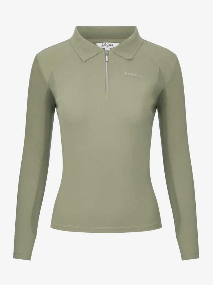 a women's long sleeved top with zippers on the collar and sleeves