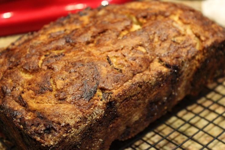 a loaf of bread sitting on top of a cooling rack