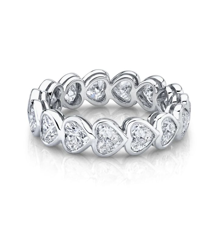 An enduring emblem of commitment and love, this heart shaped eternity band is the perfect companion for your engagement ring. This ring can be set in 14k or 18k gold and features approximately 2.5 carats of diamond hearts. Available in 14k or 18k yellow, white, or rose gold Approximately 2.5 total carat weight Diamond Color: G, Clarity: SI1 Made to order. Lead time is 4-6 weeks. Benefits of Solid Gold Jewelry Most loved for its durability and longevity Can be worn daily and requires less mainten Bezel Eternity Band, Anita Ko Jewelry, Anita Ko, Custom Wedding Rings, Heart Diamond, Heart Shaped Diamond, Solid Gold Jewelry, Womens Wedding Bands, Eternity Band Diamond