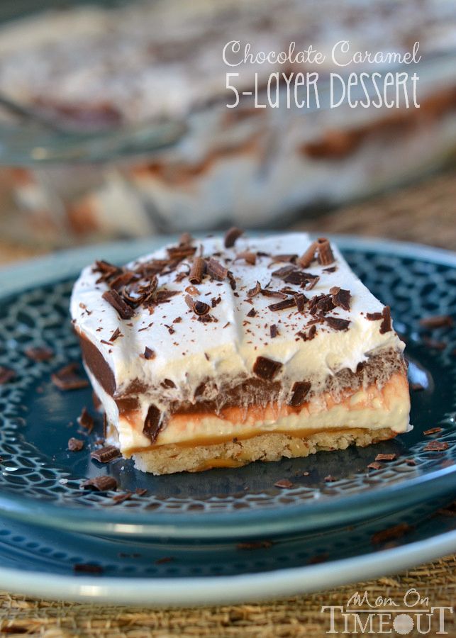 a slice of chocolate caramel s'mores dessert on a blue plate