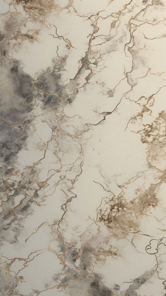 a marble counter top that looks like it has been painted white and grey with gold accents