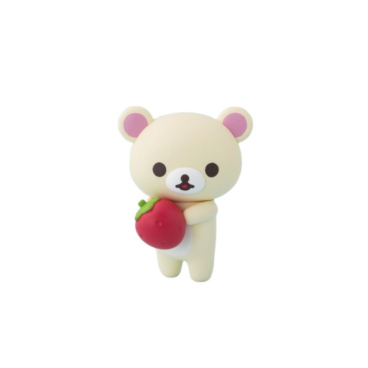 a white teddy bear holding a red apple