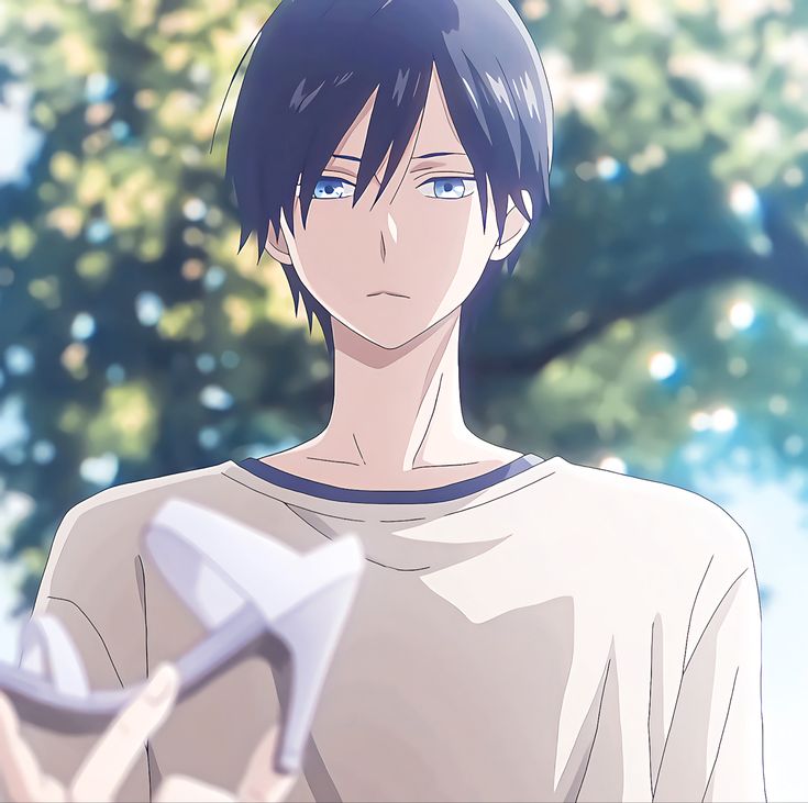 an anime character with short black hair and blue eyes holding a paper airplane in his hand