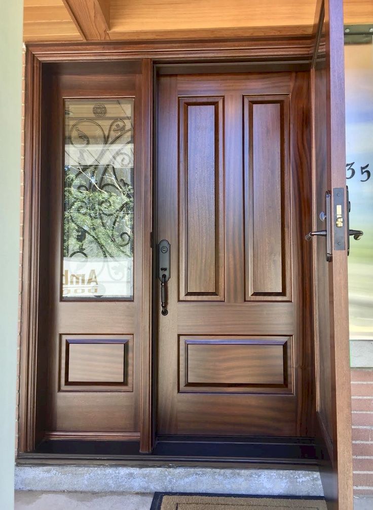 a wooden door with glass panels on it