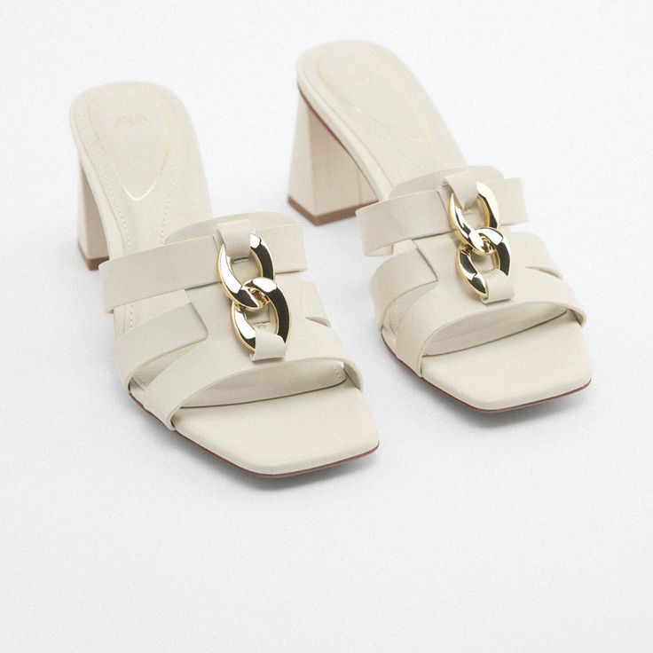 Sandals With Mid-Height Block Heels. Front Straps With Chain Detail. Squared Toe. Heel Height: 2.8 Inches (7 Cm) Airfit. Flexible Technical Sole Made Of Latex Foam Designed To Offer Increased Comfort. Size Eu39/Us8 Off White Color 3304/010 Upper 100% Polyurethane Lining 100% Polyurethane Sole 100% Polyurethane Thermoplastic Insole 100% Polvurethane S43 Elegant Summer Sandals With Chain Strap, Chic Sandals With Chain Strap And Round Toe, Summer Open Toe Heels With Chain Strap, Summer Formal Sandals With Chain Strap, Formal Summer Sandals With Chain Strap, Summer Formal Heels With Chain Strap, Spring Sandals With Chain Strap And Open Heel, Summer Heels With Chain Strap And Open Heel, Summer Open Heel Heels With Chain Strap