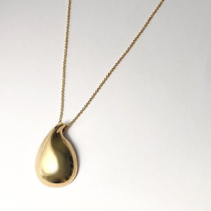 Designer Notes + Modern and elegant hand carved water drop pendant necklace that works as your everyday statement piece. DETAILS + •Color/ Material: Gold / 18K yellow gold plated brass, 3 micron electroplating. Silver/ high polished sterling silver. •Adjustable , 17 - 19" gold filled chain. • Care: Keep airtight (concealed) to maintain color and shine. Shipping + We ship worldwide. Orders start shipping in 3 to 4 weeks. Complimentary shipping within United States of America. All International or Gold Plated Teardrop Drop Necklace, Gold Teardrop Pendant Drop Necklace For Formal Occasions, Luxury Gold Plated Teardrop Necklaces, Elegant Teardrop Drop Necklace With Large Pendant, Luxury Gold Plated Teardrop Necklace, Elegant Drop Necklace With Polished Finish, Yellow Gold Drop Jewelry, Modern Teardrop Pendant With Polished Finish, Formal Drop Necklace With Polished Finish