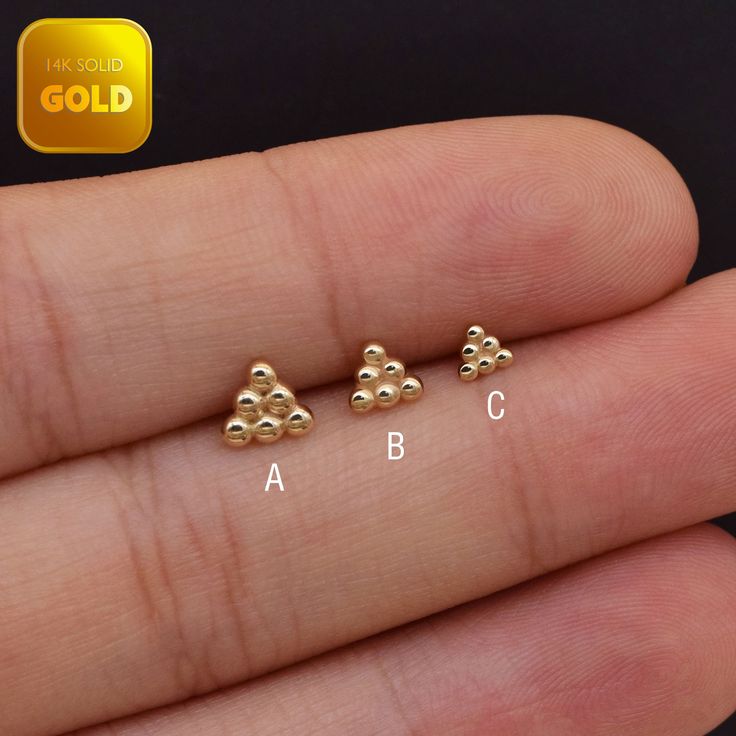 Metal: 14k solid gold, Available Gold color: Yellow gold  Guaranteed Authentic : 14K Solid Gold, Not Gold Plated, Gold filled Stone: No stone Thickness:0.82mm (20G) Stamp:14k ★Every ear is different, the length of backings that most suitable for your ear will depend on your ear thickness ★Titanium is a very safe metal, so we don't plate it, in order to avoid some people are allergic to the plating material. NOTE The item combined by 14k solid gold and implant grade titanium push in back,  packed in a beautiful Jewelry Box   SHIPPING ADDRESS All the orders will ship to the supplied address through your Etsy Order, Please leave your phone number,will give to carrier for safe deliver. We will not send and replacement parcels due to incomplete or inaccurate address.  PACKING ●Can be Gift packe Hypoallergenic Yellow Gold Plated Cartilage Earrings, Gold Hypoallergenic Round Cartilage Earrings, Hypoallergenic 14k Yellow Gold Piercings, Minimalist Gold Piercings With Matching Earrings, Gold-plated Pierced Cartilage Earrings, Gold Sterling Silver Piercings As A Gift, Dainty Gold-plated Piercings, Dainty Gold Tarnish-resistant Piercings, Hypoallergenic Yellow Gold Nose Rings For Anniversary