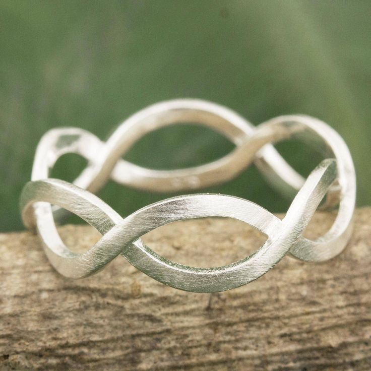 Ribbons of brushed sterling silver intertwine moving together in harmony. Always creative Sarote Lochotinunt crafts a band ring with a clean modern style. Silver Band Ring With Cut Out, Cheap Handmade Traditional Rings, Silver Rings Handmade Not On The High Street, Simple Silver Jewelry, German Silver Jewelry, Stacker Rings, Jewelry Quotes, Silver Jewelry Earrings, Silver Jewelry Design