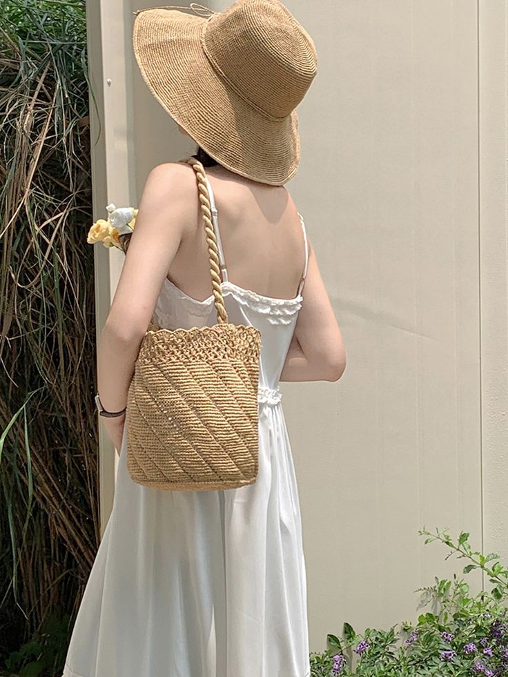 IN STOCK NOW SHIPPING FROM LOS ANGELES Add some summer vibes to your wardrobe with Elena Handbags' Raffia Basket Bag. Perfect for a day at the beach or a summer picnic, this bag is made from durable and lightweight raffia material. Stay on trend and stand out with this must-have summer fashion accessory! Natural Soft Raffia Straw Handmade No linerOpen topStrap drop 11.5 inchesSize approximately 7.5"W X 9"H X 7.5"D Designer Style ID: 8663 Beige Shoulder Bag With Braided Handles For Day Out, Summer Beige Tote Bag, Trendy Straw Shoulder Bag For Travel, Bohemian Shoulder Bag For Spring Travel, Bohemian Large Capacity Shoulder Bag For Spring, Casual Jute Bucket Bag For Spring, Casual Spring Jute Bucket Bag, Trendy Straw Bucket Bag For Travel, Trendy Basket-shaped Bucket Bag For Travel