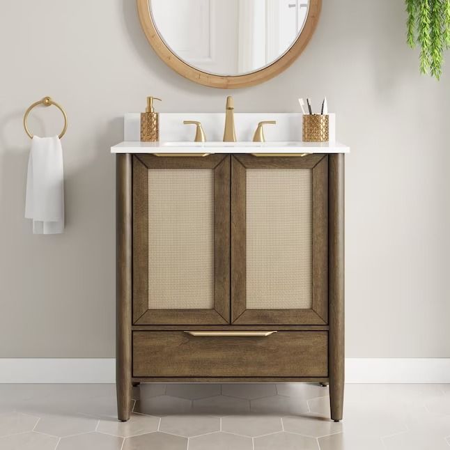 a bathroom vanity with two sinks and a mirror on the wall above it, in front of a white tiled floor