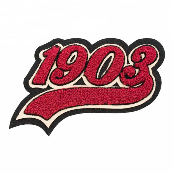 an embroidered patch with the word'908'in red and black on it