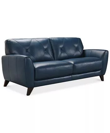 a blue leather couch with wooden legs and arm rests on an isolated white background,