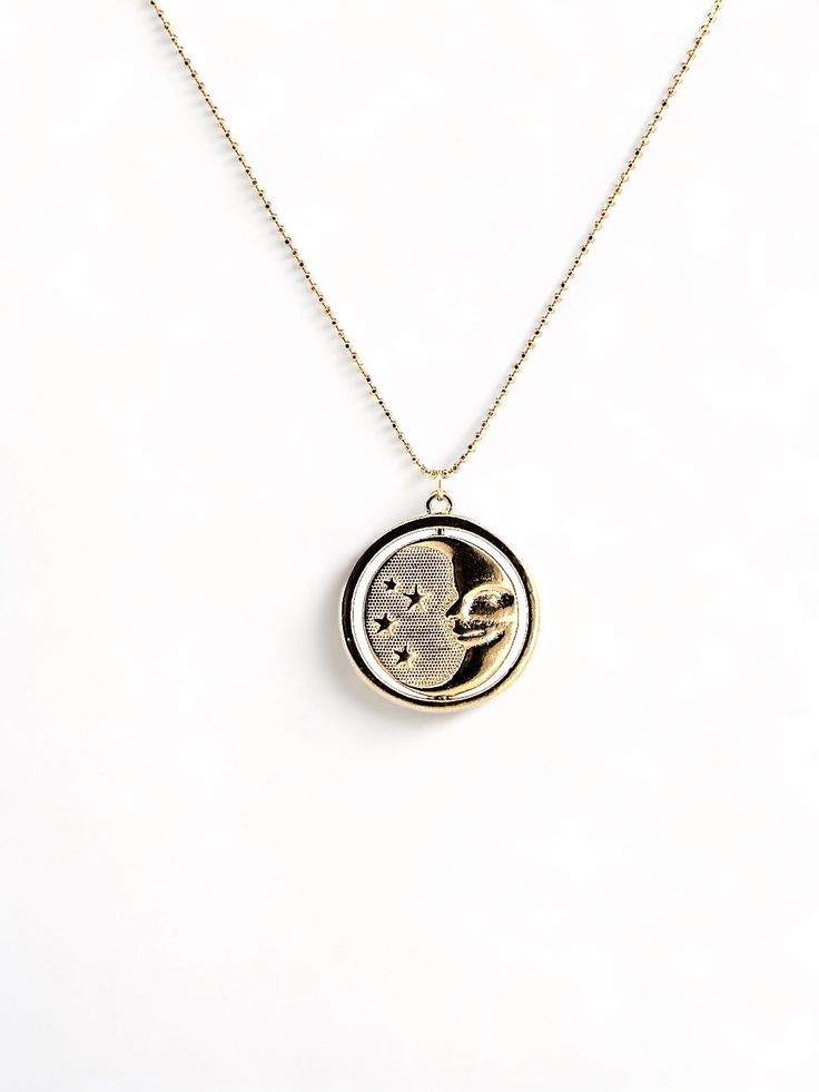 A gold rotating necklace which features the face of the sun on one side and the face of the moon on the other. Comes in 2 sizes. Small charm is 1” wide and hangs from a 16” chain Big charm is 1.5” wide and hangs from a 21” chain Moon Gold, Small Charms, Beautiful Stories, Sun And Moon, Gold Pendant Necklace, Recycled Fabric, Gold Pendant, The Moon, The Face