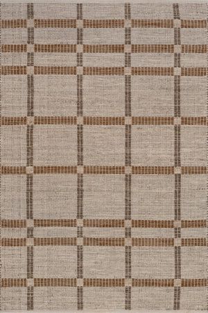 an area rug with brown and white squares on it