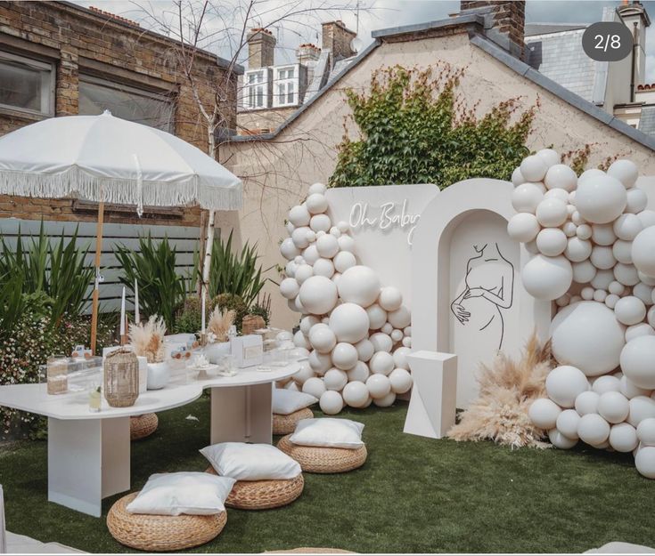 an outdoor party with balloons and tables