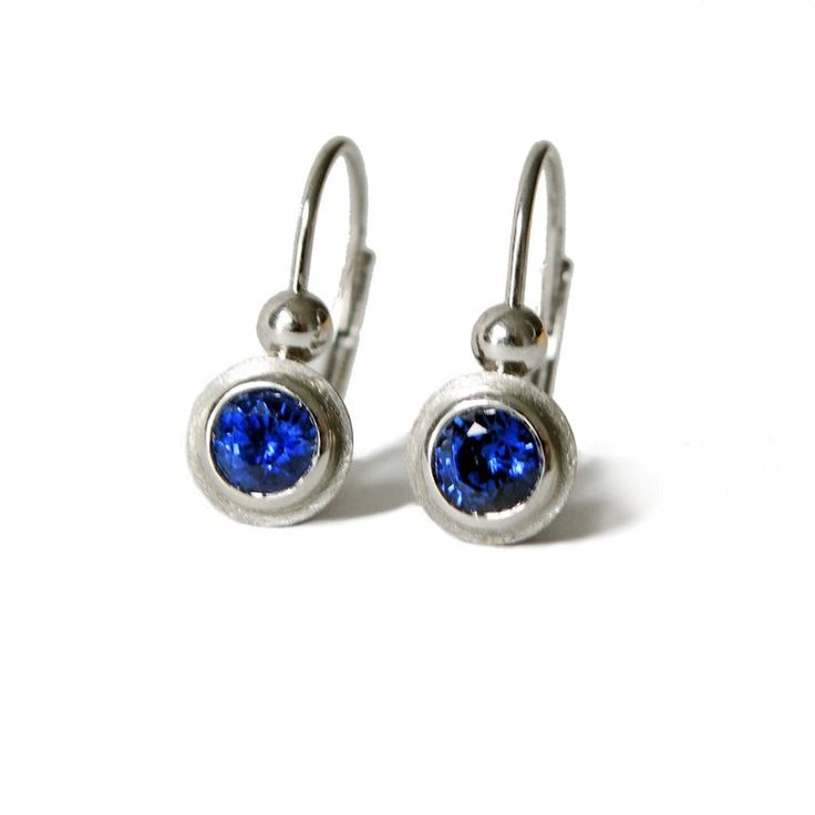 Leverback in platinum with bezel set  4 mm blue sapphires Modern Sapphire Sterling Silver Earrings, Elegant Sapphire Jewelry With Tension Setting, Modern Sapphire Gemstone Earrings, Classic Blue Earrings For Everyday, Classic Silver Sapphire Earrings, Ethical Sapphire White Gold Earrings, White Gold Sapphire Birthstone Earrings, Sterling Silver Bezel Set Fine Earrings, Sterling Silver Bezel Set Round Earrings