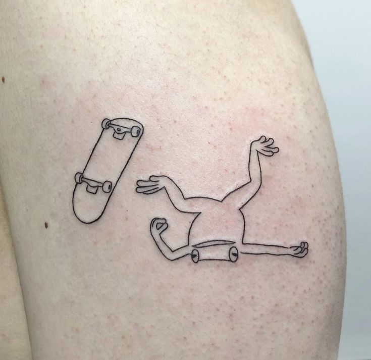 two skateboarders are depicted on the back of a woman's thigh,