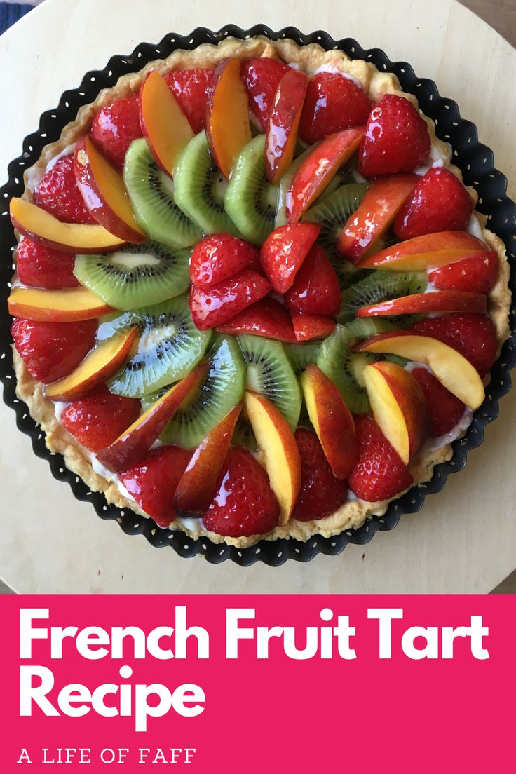 a fresh fruit tart on top of a table