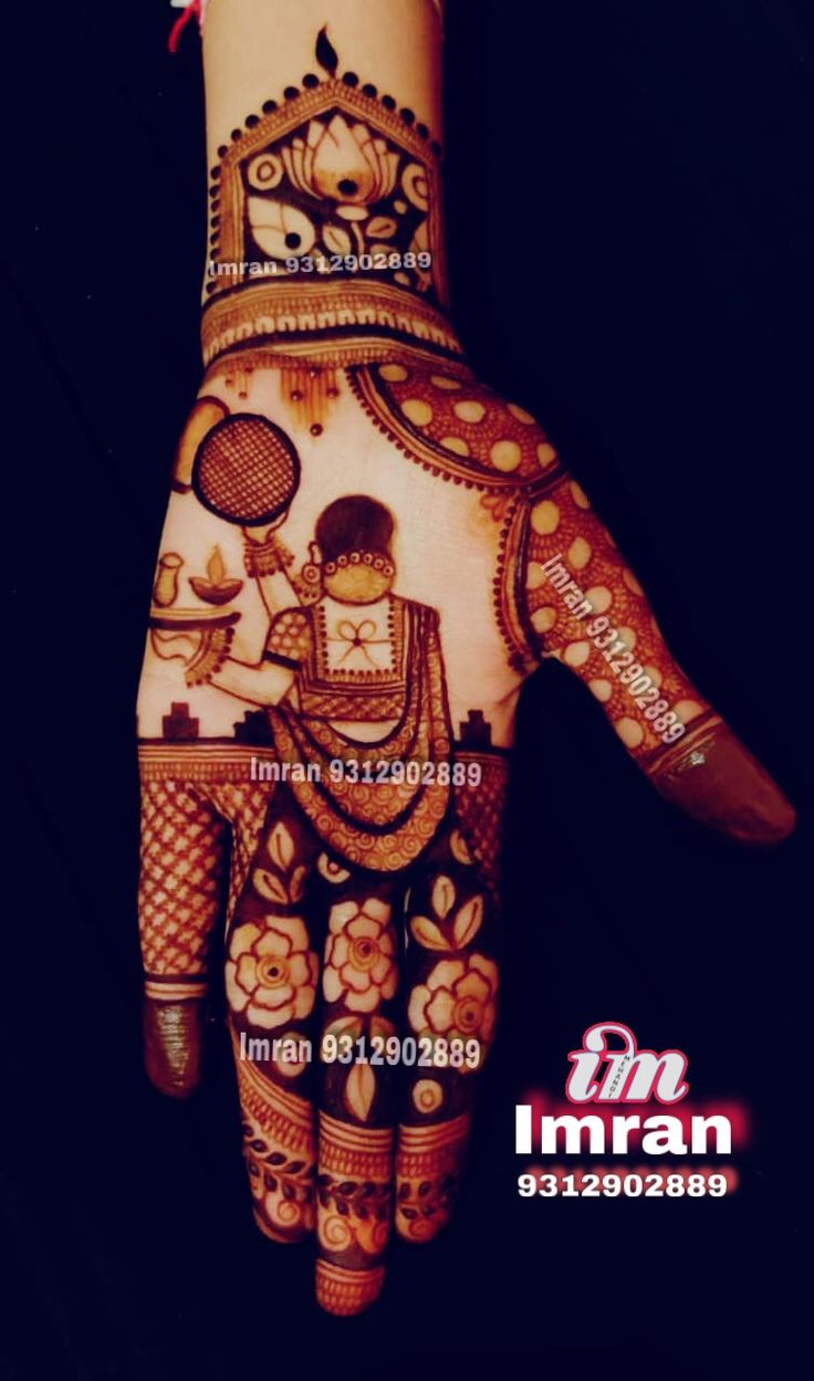 the hand is decorated with henna and flowers