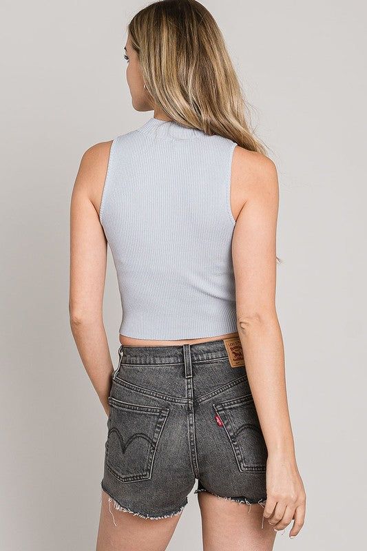 This sleeveless mock neck knit top is classy and with a cropped length, its perfect with some high waisted slacks or jeans. With a fantastic stretch fit, this will be your go to for an elevated look. In Black, Mauve, and Sky Blue. 63101 Trendy Turtleneck Tank Top For Spring, Casual Stretch Mock Neck Cropped Top, Casual Stretch Cropped Mock Neck Top, Fitted Casual Cropped Mock Neck Top, Stretch Cropped Tank Top For Fall, Fitted Mock Neck Top For Night Out, Casual Mock Neck Top For Night Out, Spring Cropped Fitted Mock Neck Top, Spring Turtleneck Stretch Crop Top