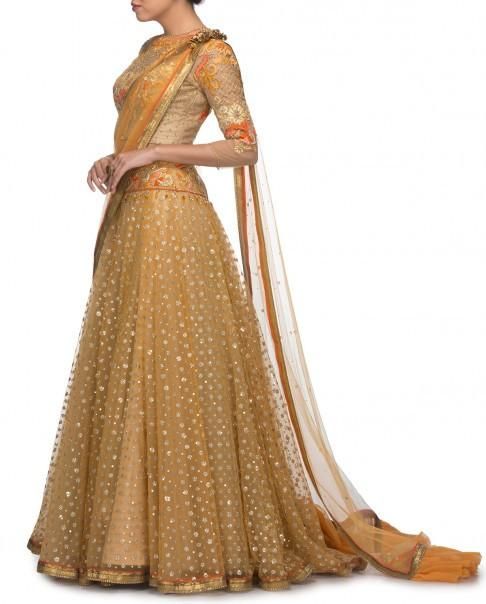 Golden Lehenga Choli Replica from Tarun Tahiliani Collection Gold Anarkali Pre-draped Saree With Sheer Dupatta, Gold Pre-draped Saree With Sheer Dupatta For Navratri, Gold Organza Pre-draped Saree For Navratri, Gold Floor-length Anarkali Set With Sheer Dupatta, Anarkali Style Gold Pre-draped Organza Saree, Gold Sharara With Sheer Dupatta In Raw Silk, Gold Raw Silk Sharara With Sheer Dupatta, Gold Chanderi Choli For Wedding, Gold Tissue Silk Anarkali Set With Sheer Dupatta