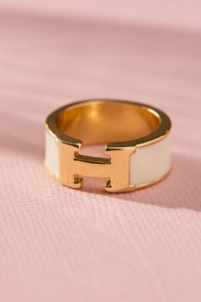 This elegant H enamel band ring is a stylish and effortless accessory to spice up your look. The ring's sleek, minimalist design features a single band of vibrant enamel. This versatile ring is perfect for everyday wear and it makes a great gift for anyone who appreciates timeless elegance and modern design. Christmas List Items 2024, My Christmas Wishlist Gift Ideas, White Enamel Ring, Rings And Bracelets Aesthetic, Chunky Gold Rings, Enamel Rings, Ring Stacks, Preppy Jewelry, Gold Rings Simple