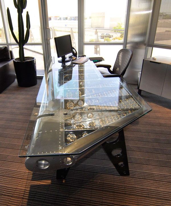 a glass table topped with lots of watches and watch faces on it's sides