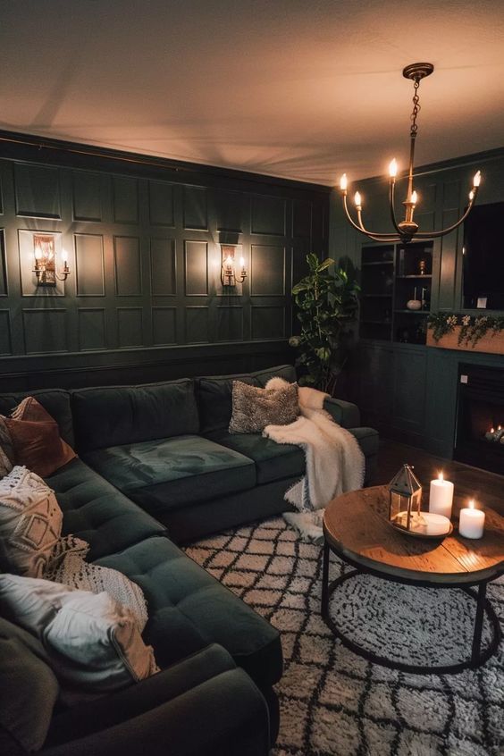 a living room filled with lots of furniture and candles on top of it's coffee table