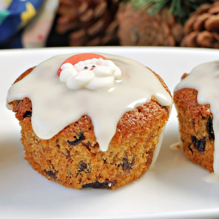 two mini christmas cakes on a white plate