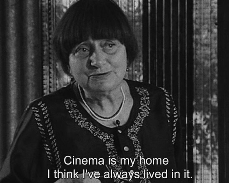 an older woman is sitting in front of a window with the words cinema is my home i think i've always lived in it