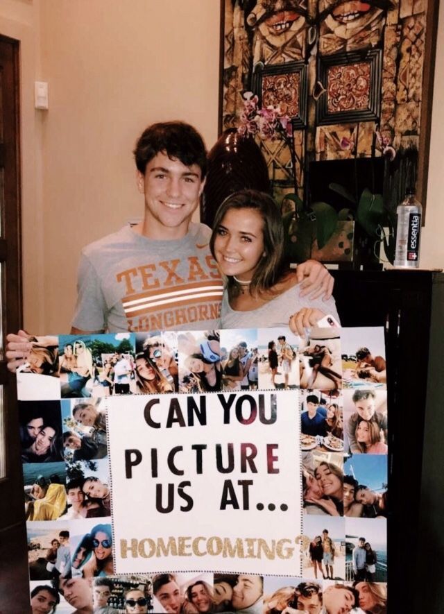 a man and woman standing next to each other holding a sign that says can you picture us at