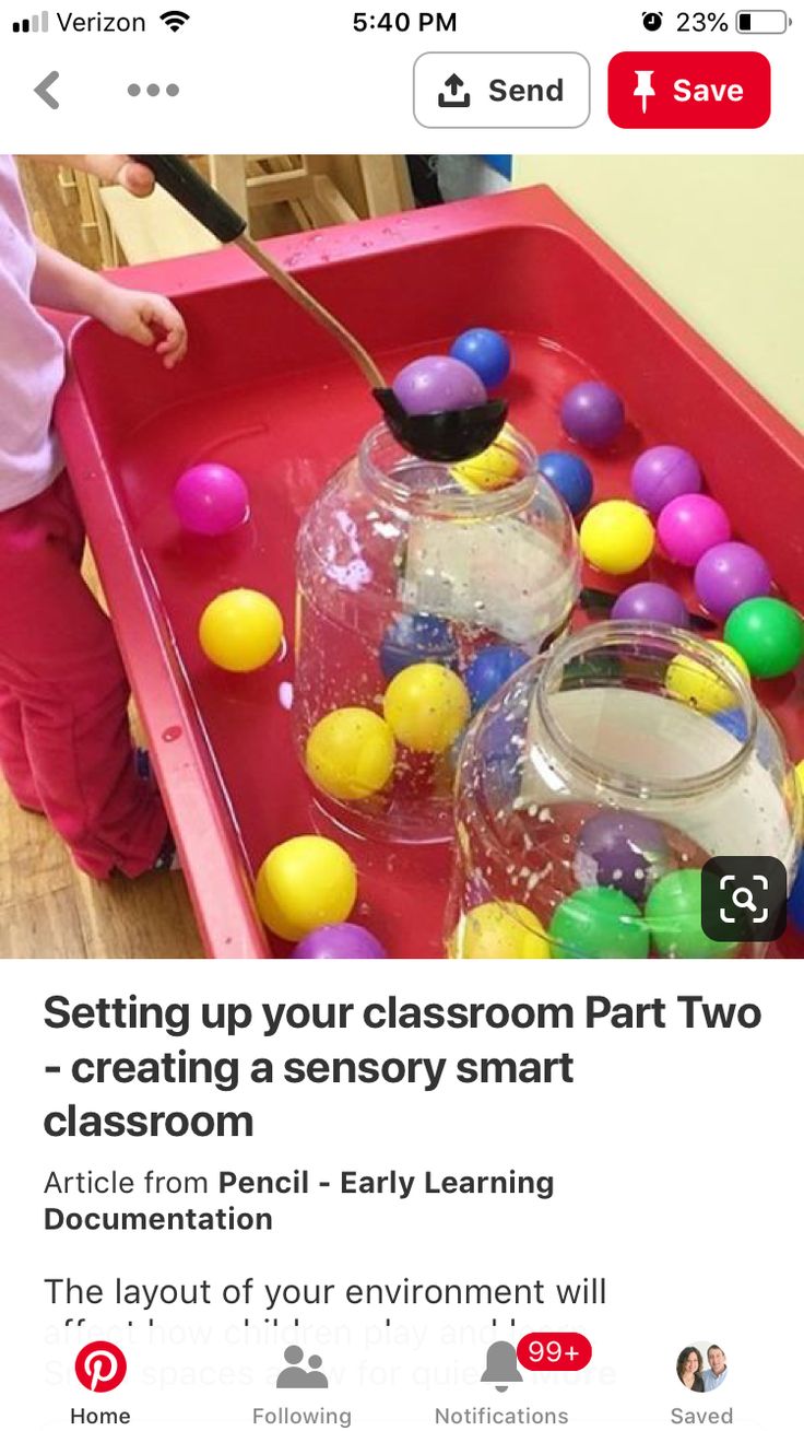 an image of a child playing with balls in a play area that is filled with water