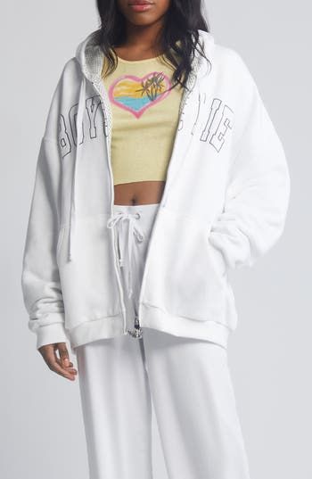 A roomy hoodie features a beachy image and the brand's signature spelled out on the front. 27" length (size M/L) Front zip closure Drawstring hood Split kangaroo pocket 99% rayon, 1% spandex Machine wash, tumble dry Imported White Sporty Hoodie For Leisure, White Athleisure Hoodie With Drawstring, Sporty White Hoodie For Leisure, Casual White Hoodie With Drawstring, White Hoodie With Drawstring For Streetwear, White Drawstring Hoodie For Streetwear, White Drawstring Hood Sweatshirt For Leisure, White Cotton Hoodie For Leisure, White Cotton Leisure Hoodie