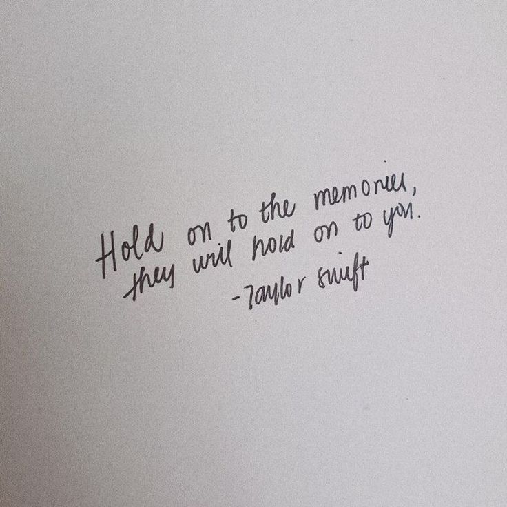 a handwritten quote on a white wall